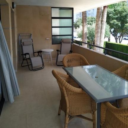 a balcony with chairs and a table on a balcony at Morello 1A in Calpe