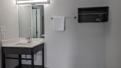 a bathroom with a sink and a mirror at Motel 6-Leominster, MA in Leominster