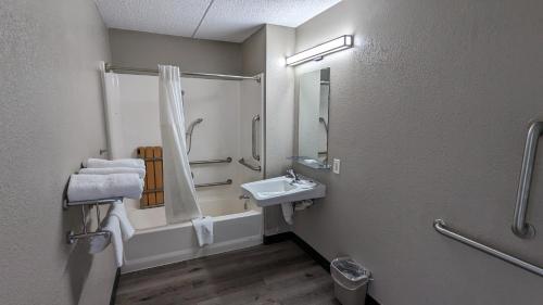 a bathroom with a sink and a shower at Motel 6-Leominster, MA in Leominster