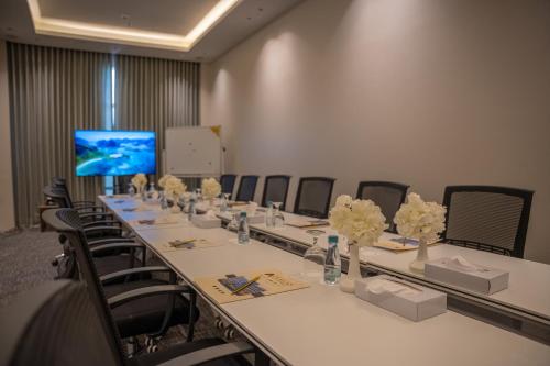 a conference room with a long table and chairs at Rosemond Al Hamra in Jeddah