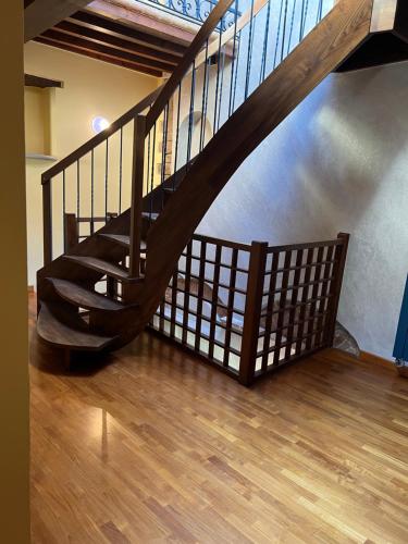 a wooden staircase in a room with a wooden floor at Palazzo Collesi in Città di Castello