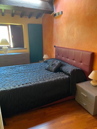 a bedroom with a bed and a window at Palazzo Collesi in Città di Castello