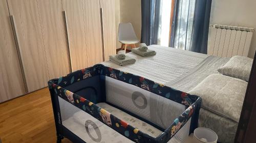 a bed in a room with a bed frame at Rose e Frutta - Yellow Daisy in Ronchi dei Legionari