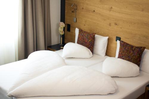 Postel nebo postele na pokoji v ubytování Hotel Montfort
