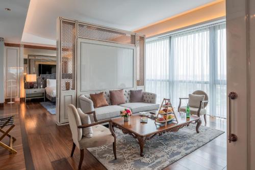 a living room with a couch and a table at Hilton Tashkent City in Tashkent
