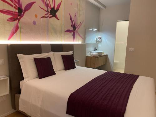 Ein Bett oder Betten in einem Zimmer der Unterkunft SAN LORENZO Luxury Boutique