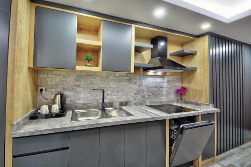 a kitchen with a sink and a stove at North Blue Life in Istanbul