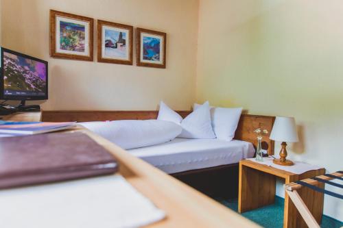 Postel nebo postele na pokoji v ubytování Hotel Montfort