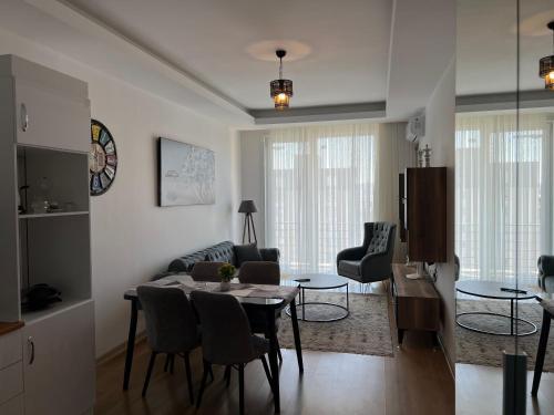 a kitchen and living room with a table and chairs at New Furnished Flat Central Location Free WIFI AC in Esenyurt