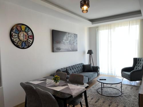 a living room with a couch and a table at New Furnished Flat Central Location Free WIFI AC in Esenyurt