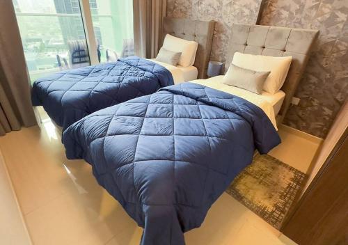 Postel nebo postele na pokoji v ubytování MH- Cozy 1 bedroom in Reva Residence