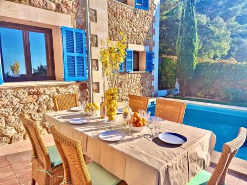 a dining room with a table and chairs at VILLA SOFIA in Valldemossa