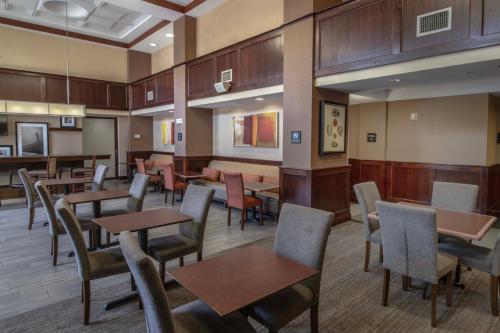 a dining room with tables and chairs at Hampton Inn & Suites Norfolk-Airport in Norfolk