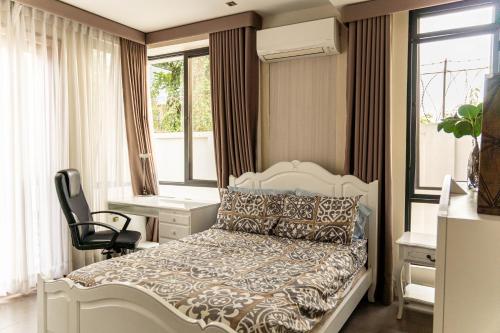 เตียงในห้องที่ Tata Amado: 3-bedroom vacation home + pool + sauna
