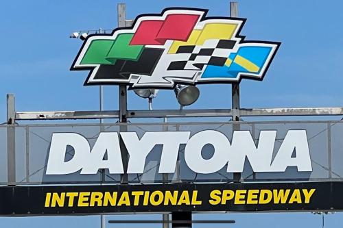 a neon sign for a dannel international speedway at By The Sea Turtles in Ponce Inlet