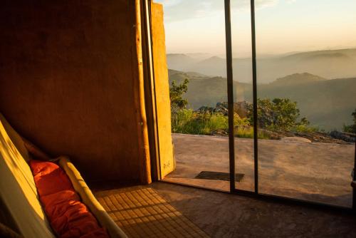 an open door to a room with a view at Louis at Magwa Falls in Lusikisiki