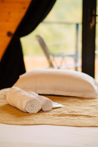 a knife sitting on a cutting board next to a sink at Oda Riverside Cottages in Aragvispiri