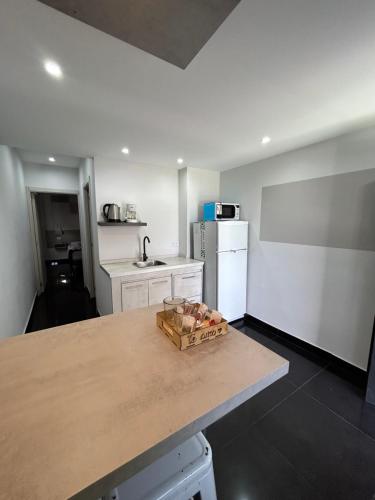 a kitchen with a table with a box on it at Terrazas del Fortín in San Salvador de Jujuy