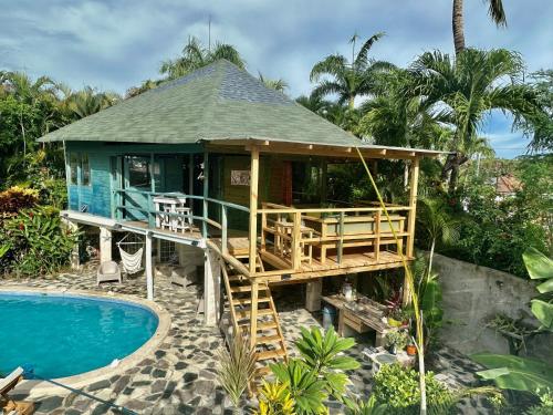 a house with a deck next to a pool at Cabarete Boutique Kite Hotel for up to 15 people in Cabarete