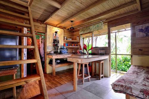 a kitchen with wooden walls and a table in a room at Cabarete Boutique Kite Hotel for up to 15 people in Cabarete