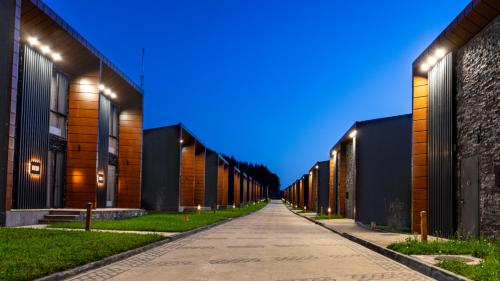 a long alley with lights on the sides of buildings at Kass Diamond Resort in Tsalka