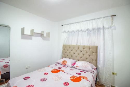 Posteľ alebo postele v izbe v ubytovaní ¡casa con parqueadero! Hogareña y vacacional