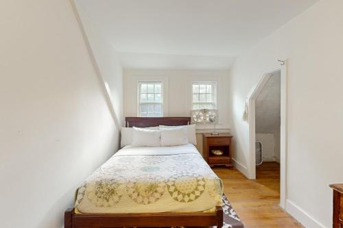 a bedroom with a bed in a room at The Farmhouse Back House in Montpelier