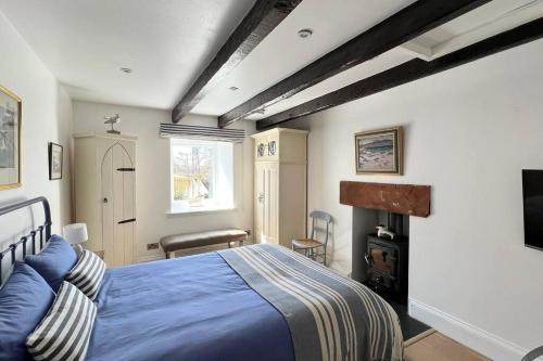 Postel nebo postele na pokoji v ubytování Shorepark - waterfront cottage with stunning views