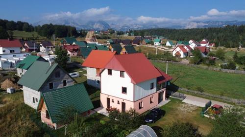 an aerial view of a small village with houses at Deluxe Studio & Rooms Zarubica in Žabljak