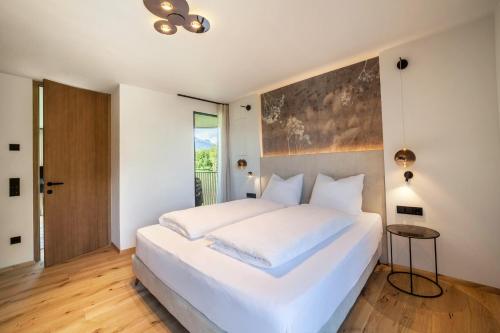 מיטה או מיטות בחדר ב-Natur Romantik Apartment Annalena