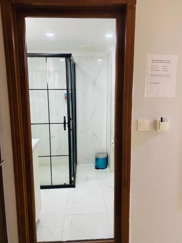 a bathroom with a shower with a glass door at Stylish Hotel Old City in Istanbul