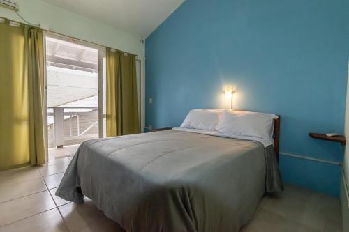 Un pat sau paturi într-o cameră la Lagoa dos Ventos