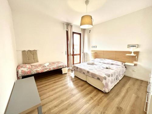 Postel nebo postele na pokoji v ubytování Vittoria Apartament
