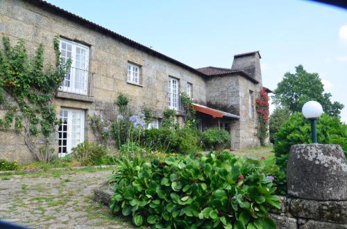 a house with a garden in front of it at Casal do Outeiro by LovelyStay in Marco de Canaveses