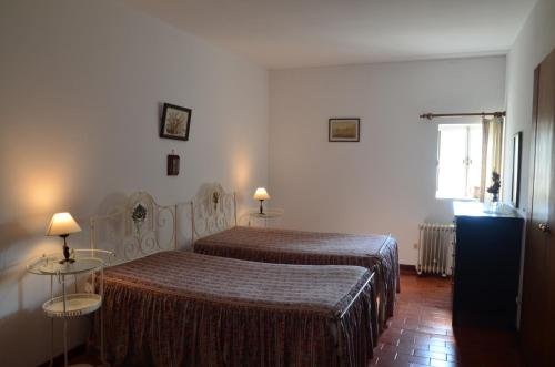 a bedroom with two beds and a window at Casal do Outeiro by LovelyStay in Marco de Canaveses
