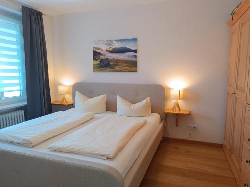 Postel nebo postele na pokoji v ubytování Auwaldsee