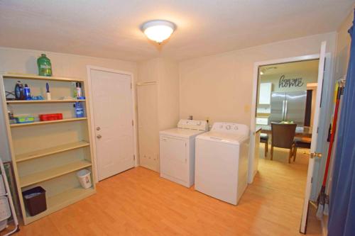 a laundry room with a washer and dryer in it at Home Sweet Home - Peace, Love, & Enjoy in Kingsville