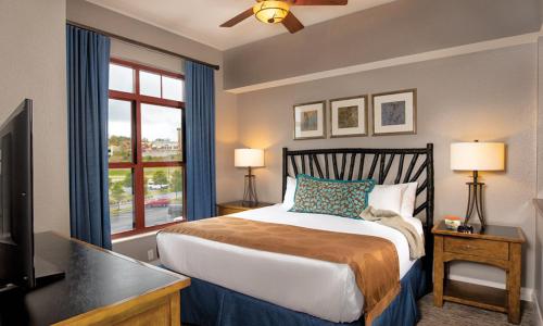 a bedroom with a large bed and a window at Great Smokies Lodge Resort 2BR in Sevierville