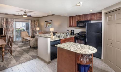 a kitchen with black appliances and a living room at 2 Bedroom Deluxe Villa at the Wyndham Nashville Resort in Nashville