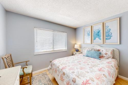 Ένα ή περισσότερα κρεβάτια σε δωμάτιο στο Plantation East #1308