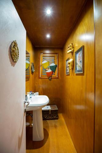 a bathroom with a white sink in a room at Luxury apartment in Venice in Venice