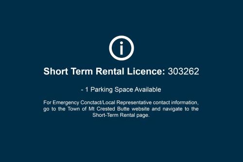 a sign that reads short term rental licence parking space available at Beautiful Mountain View Condo in Crested Butte