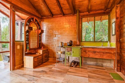 a kitchen with a counter and a sink in a room at Cabaña Tipo Glamping Savieza Life Experience in Nemocón