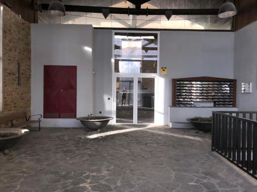 a large room with a door and a person walking through it at Sierra Nevada Galatino 22E in Sierra Nevada