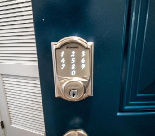 a door with an alarm clock on it at The Josi:Elegant space and view in Washington, D.C.