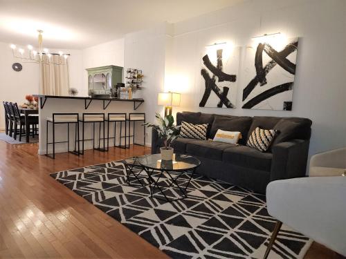 a living room with a couch and a table at Bethlehem Bliss:10min to Valley Festivals & Events in Bethlehem