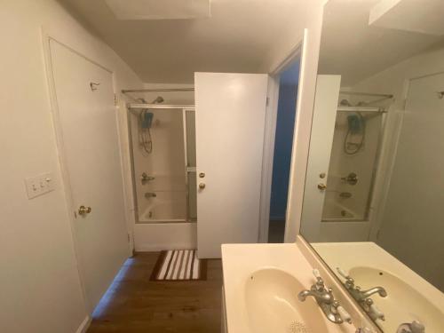 a bathroom with a tub and a sink and a shower at Los Angeles Zen Home in Los Angeles