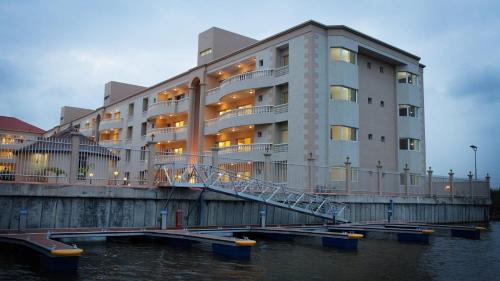 a building next to a body of water at Guided Hospitality - Luxury Accommodations in Lagos
