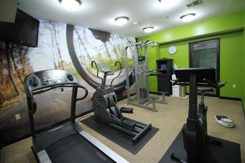 a fitness room with a treadmill and a gym at Best Western Slidell Hotel in Slidell