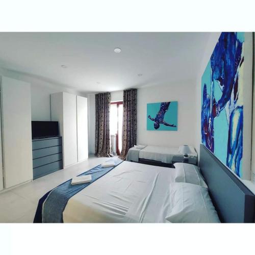 Ένα ή περισσότερα κρεβάτια σε δωμάτιο στο GArt Riviera B&B